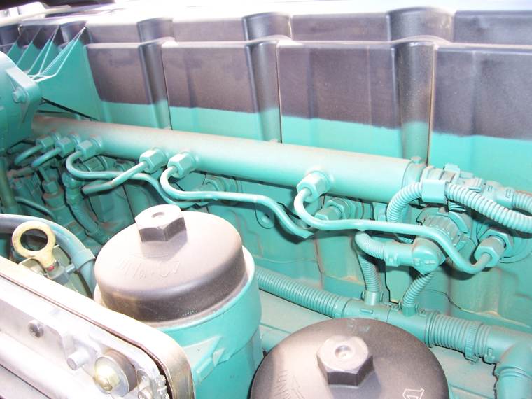 Close-up of a heavy-duty diesel engine with oil filters